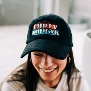 This black corduroy dad cap features our signature red-white-and-blue Empty Kodiak logo embroidered on the front. Soft, durable, and perfectly broken-in, it’s the everyday essential for fans who want to rep the band with subtle, effortless vibe. Adjustable strap for a comfortable fit.