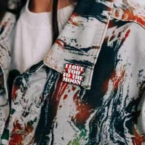 Tell someone you love them everywhere and no matter what. The ILYTTM soft enamel pin features bold red and white lettering, inspired by our song “We’re Gonna Be Okay.” A perfect collectible for fans, this durable pin adds a pop of color and a statement of support to jackets, bags, hats, or anywhere you want to show you’re part of the Empty Kodiak clique.